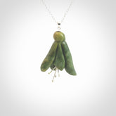 This picture shows a beautiful flower jade flower pendant with sterling silver flowers. This is a spectacular work of art and is a one off piece. Hand carved from New Zealand Flower Jade with sterling silver flowers, replicating a beautiful flower.